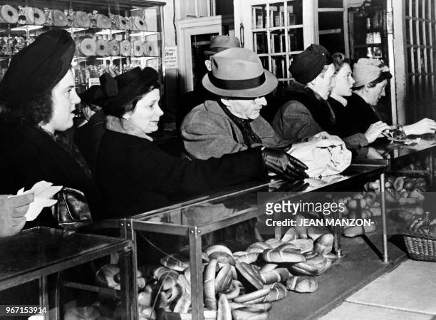 Berliner queue to buy rare and expensive products in a bakery in Berlin in December 1948 during the Berlin blockade. On June 24 during the Cold War,...