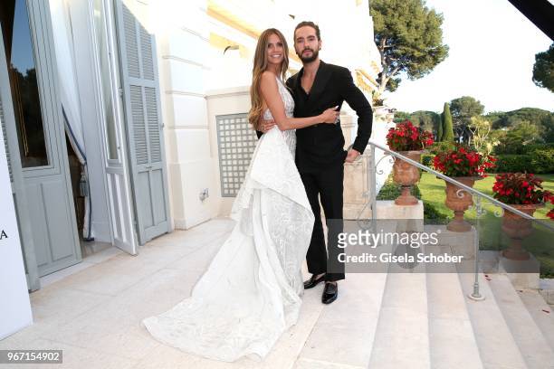 Heidi Klum and her boyfriend Tom Kaulitz during the amfAR Gala Cannes 2018 at Hotel du Cap-Eden-Roc on May 17, 2018 in Cap d'Antibes, France.