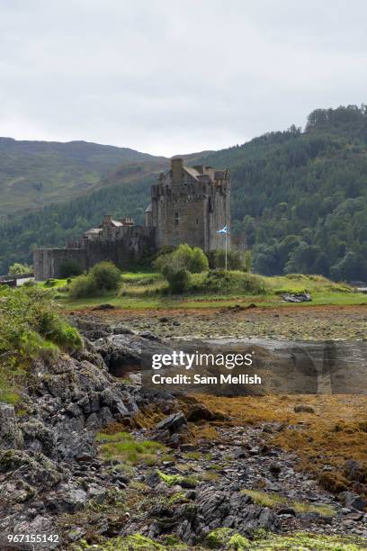 Low tide at Eilean Donan castle on the 1st September 2016 in Dornie in Scotland in the United Kingdom. Eilean Donan castle is situated on Eilean...
