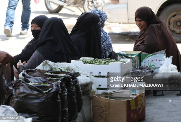 Vendors sell homemade white cheese and eggs in downtown Amman on June 4 , 2018. Jordan's King Abdullah has summoned the prime minister for a meeting...