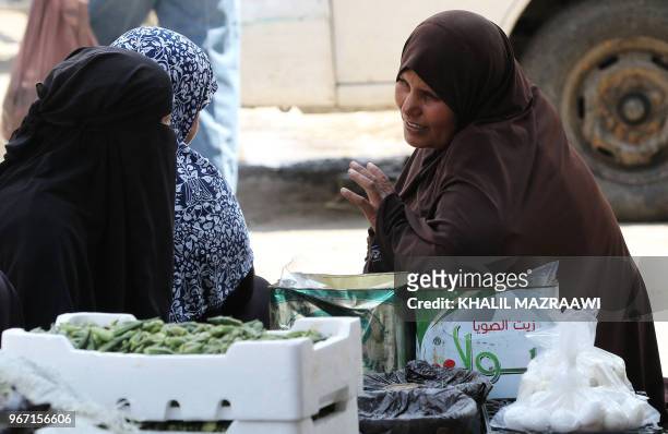Vendors sell homemade white cheese and eggs in downtown Amman on June 4 , 2018. Jordan's King Abdullah has summoned the prime minister for a meeting...