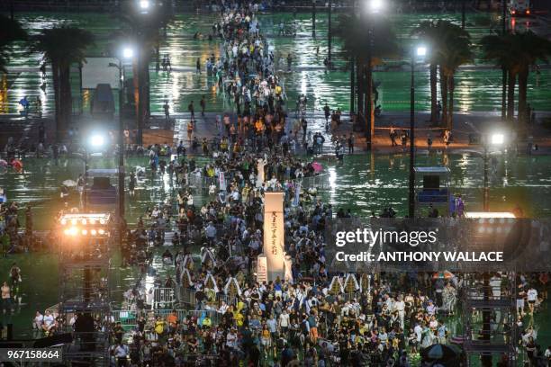 People arrive in Victoria Park ahead of a candlelight vigil in Hong Kong on June 4 to mark the 29th anniversary of the 1989 Tiananmen crackdown in...