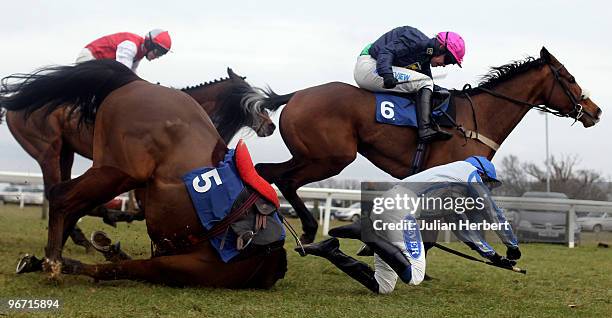 Timmy Murphy and Preuty Boy pass Liam Treadwell as he parts company with Ballybach to go on and win The totesuper7 Handicap Hurdle Race run at...