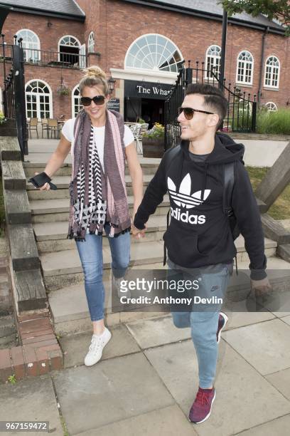 Gemma Atkinson and Gorka Marquez walk hand in hand as Gemma Atkinson, Gethin Jones and Dave Vitty from The Hits Radio celebrates the airing of their...