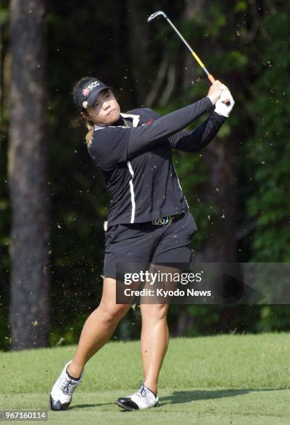 Ariya Jutanugarn of Thailand takes her second shot on the 17th hole of the final round of the U.S. Women's Open at Shoal Creek Golf and Country Club...