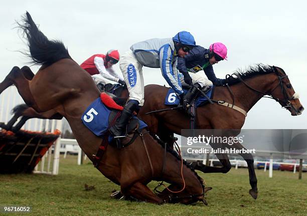 Timmy Murphy and Preuty Boy pass Liam Treadwell as he parts company with Ballybach to go on and win The totesuper7 Handicap Hurdle Race run at...