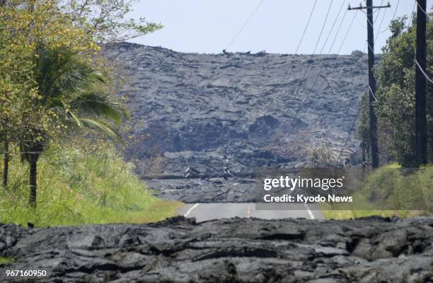 Photo shows a road covered with lava from Mt. Kilauea in Pahoa on Hawaii Island on June 3, 2018. ==Kyodo