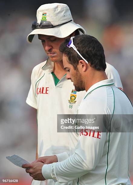 Mark Boucher of South Africa gives instructions to Paul Harris at the drinks break during day two of the Second Test match between India and South...