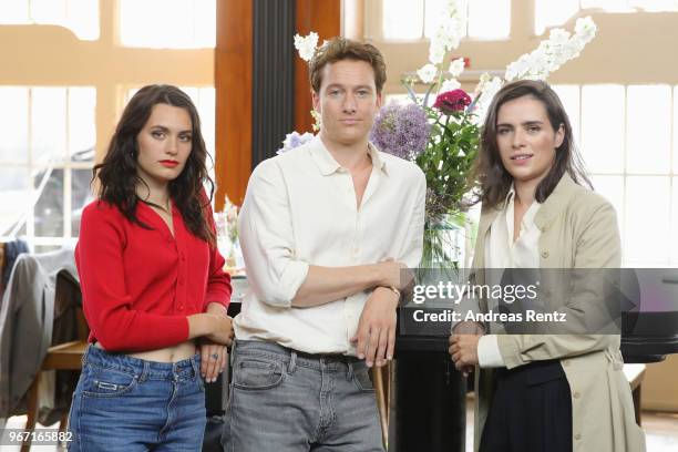 Ella Rumpf, Alexander Fehling and Nora Tschirner pose during 'Gut gegen Nordwind' on set photocall on June 4, 2018 in Cologne, Germany.