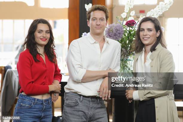 Ella Rumpf, Alexander Fehling and Nora Tschirner pose during 'Gut gegen Nordwind' on set photocall on June 4, 2018 in Cologne, Germany.