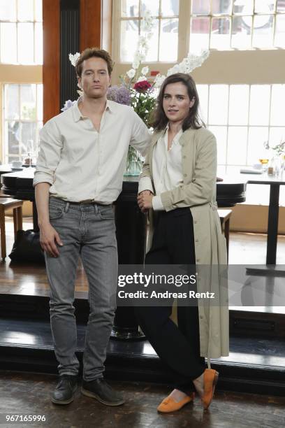 Alexander Fehling and Nora Tschirner pose during 'Gut gegen Nordwind' on set photocall on June 4, 2018 in Cologne, Germany.