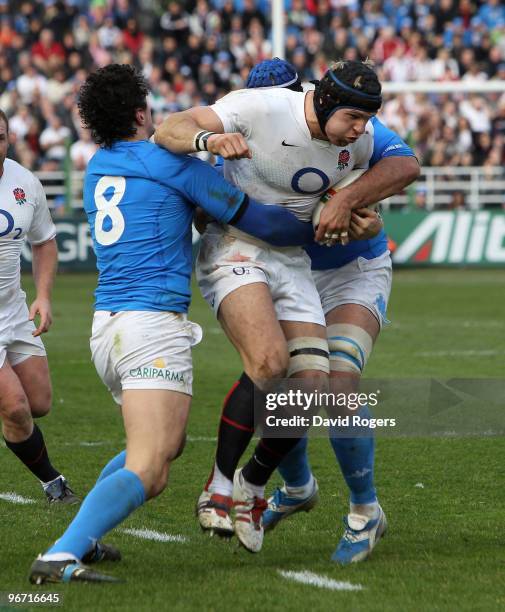 James Haskell of England is tackled by Alessandro Zanni and Marco Bortolami during the RBS Six Nations match between Italy and England at Stadio...