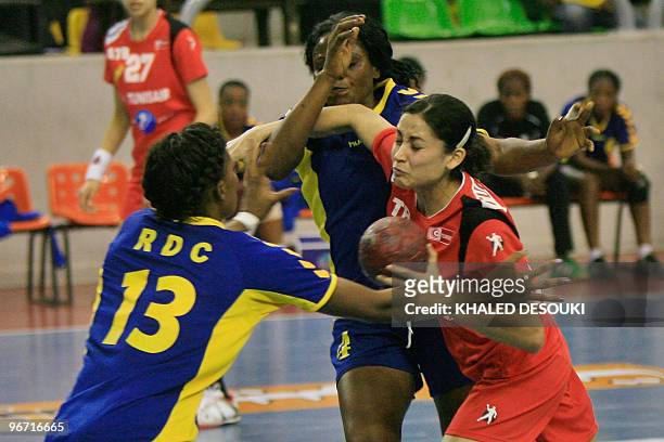 Mouna Chebbah of Tunis is challenged by Feza Mwange Consolate and Musonda Kasangala Lydia of Congo during their quarter-final match in 19th Africa...
