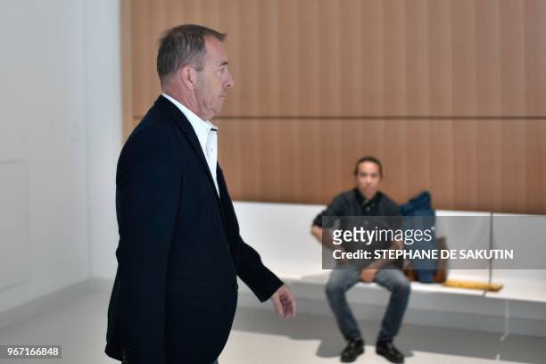 Defendant Jean-Marc Conrad, former Nimes Olympique football club president, arrives at Paris' courthouse on June 4, 2018 for his trial along with...