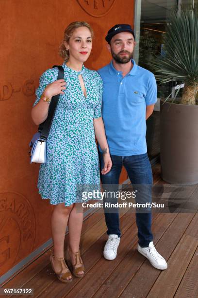 Actress Alysson Paradis and her companion Guillaume Gouix attend the 2018 French Open - Day Nine at Roland Garros on June 4, 2018 in Paris, France.