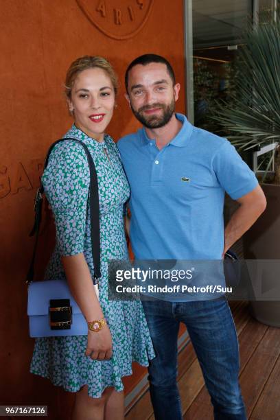 Actress Alysson Paradis and her companion Guillaume Gouix attend the 2018 French Open - Day Nine at Roland Garros on June 4, 2018 in Paris, France.