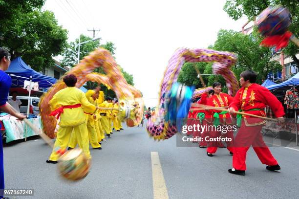 On the afternoon of June 4 more than a thousand farmers in shuangfeng town, taicang city, jiangsu province, China, walked on the street and danced...