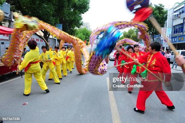 On the afternoon of June 4 more than a thousand farmers in shuangfeng town, taicang city, jiangsu province, China, walked on the street and danced...