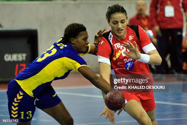 Ines Khouildi of Tunis is challenged by Musonda Kasangala Lydia of Congo during their quarter-final match in 19th Africa Nations Handball...