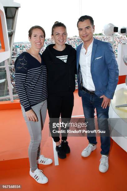 Tennis player Justine Henin, Tennis player Simona Halep and Sports Journalist Laurent Luyat pose at France Television french chanel studio during the...