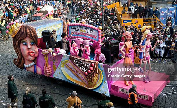 Carnival float with papier mache figures of thin models is pictured during the traditional Rose Monday carnival parade on February 15, 2010 in...