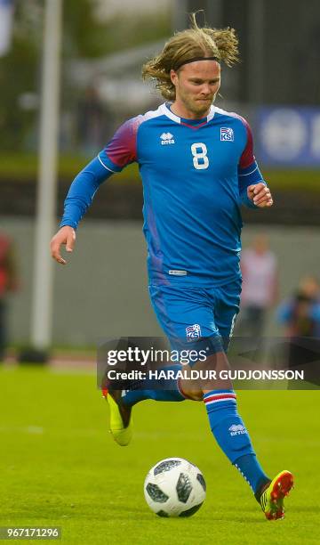 Iceland's midfielder Birkir Bjarnason runs with the ball during the international friendly football match Iceland v Norway in Reykjavik, Iceland on...