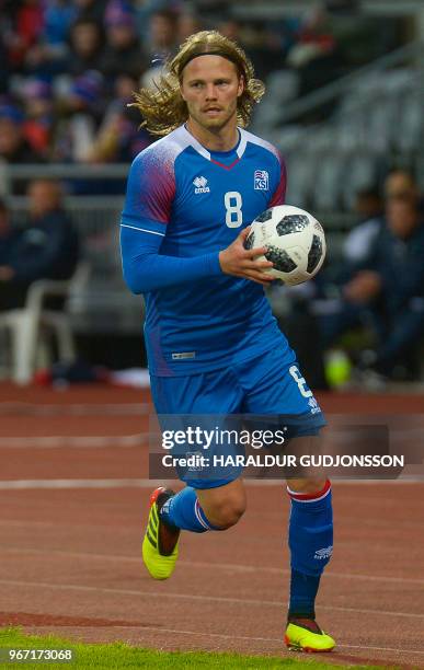 Iceland's midfielder Birkir Bjarnason holds the ball during the international friendly football match Iceland v Norway in Reykjavik, Iceland on June...