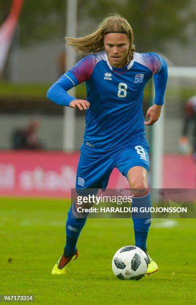 Iceland's midfielder Birkir Bjarnason runs with the ball during the international friendly football match Iceland v Norway in Reykjavik, Iceland on...