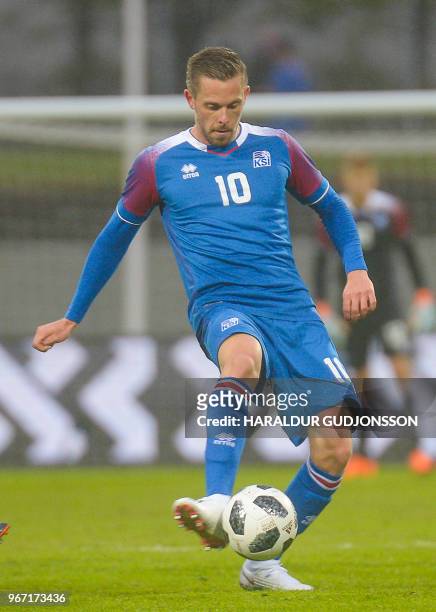 Iceland's midfielder Gylfi Sigurdsson plays the ball during the international friendly football match Iceland v Norway in Reykjavik, Iceland on June...