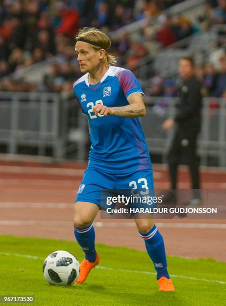 Iceland's defender Ari Skulason plays the ball during the international friendly football match Iceland v Norway in Reykjavik, Iceland on June 2,...