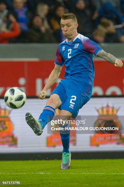 Iceland's defender Birkir Saevarsson plays the ball during the international friendly football match Iceland v Norway in Reykjavik, Iceland on June...