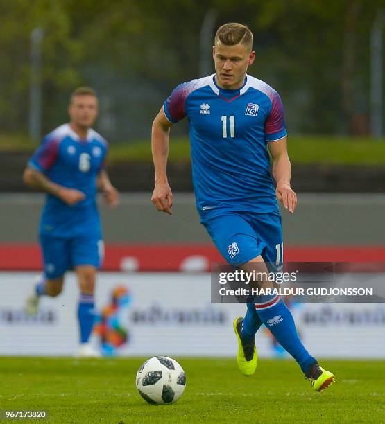 Iceland's forward Alfred Finnbogason plays the ball during the international friendly football match Iceland v Norway in Reykjavik, Iceland on June...