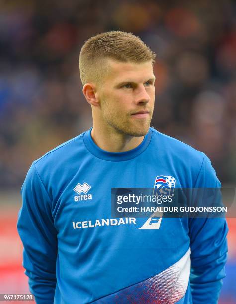 Iceland's midfielder Johann Berg Gudmundsson lines up prior to the international friendly football match Iceland v Norway in Reykjavik, Iceland on...