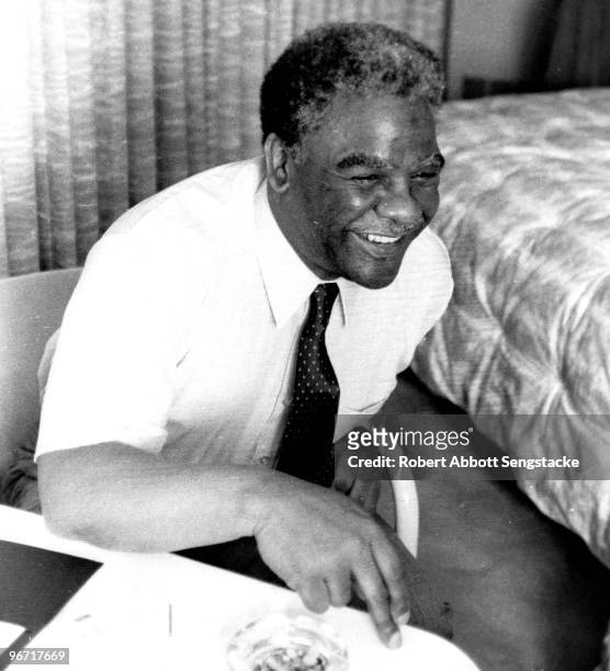 View of Chicago Mayor Harold Washington as he laughs in his hotel suite, San Francisco, CA, 1984. He found it amusing that a Chicago Defender...