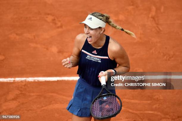 Germany's Angelique Kerber celebrates after victory over France's Caroline Garcia during their women's singles fourth round match on day nine of The...