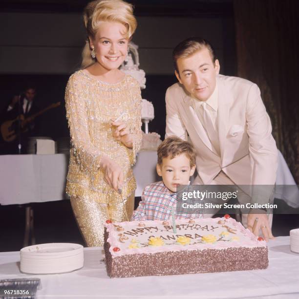 American singer Bobby Darin celebrates the birthday of his wife, actress Sandra Dee , with their son Dodd, circa 1966.