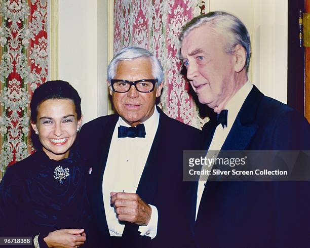 Actors Cary Grant and James Stewart with Grant's wife Barbara Harris, circa 1982.