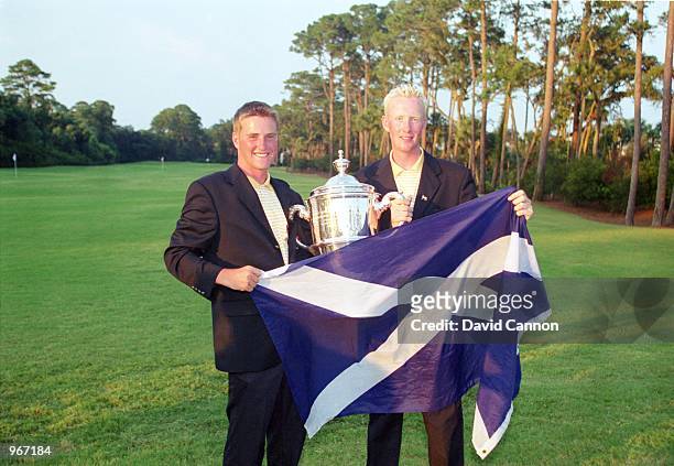 Scottish Pair Marc Warren and Steven O''Hara of the Great Britain and Ireland team parade the Scottish Flag after the 38th Walker Cup match played at...