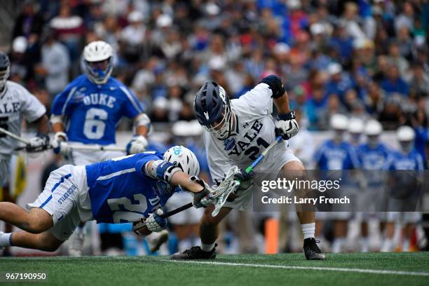 Conor Mackie of Yale University and Brian Smyth of Duke University battle for the ball during the Division I Men's Lacrosse Championship Semifinals...