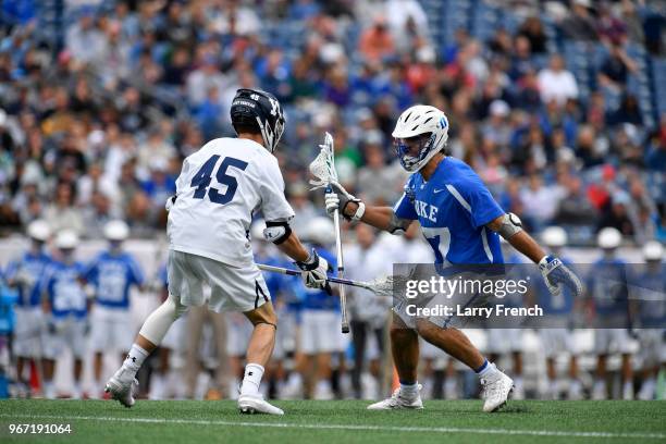 Jason Alessi of Yale University defends against Brad Smith of Duke University during the Division I Men's Lacrosse Championship Semifinals held at...