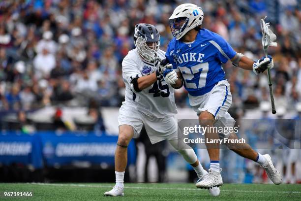 Jason Alessi of Yale University defends against Brad Smith of Duke University during the Division I Men's Lacrosse Championship Semifinals held at...