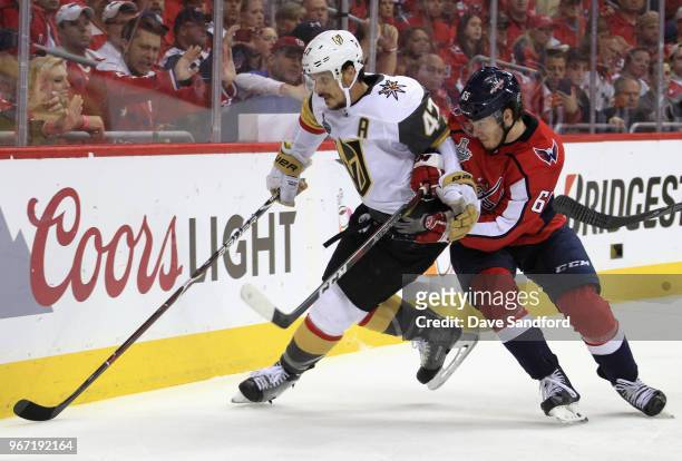 Luca Sbisa of the Vegas Golden Knights defends against Andre Burakovsky of the Washington Capitals in Game Three of the 2018 NHL Stanley Cup Final at...