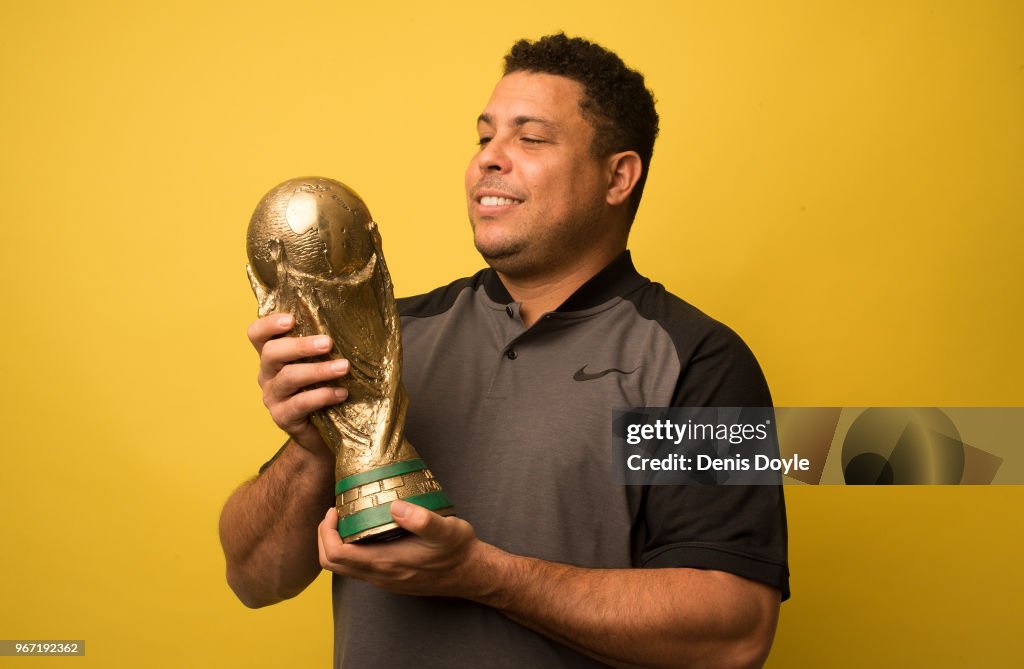 Ronaldo Nazario looks at his 2002 FIFA World Cup winners trophy