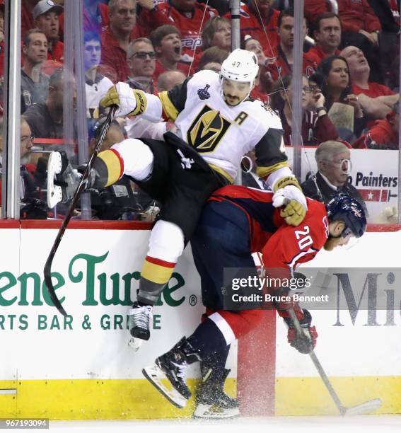 Lars Eller of the Washington Capitals gets under Luca Sbisa of the Vegas Golden Knights during Game Three of the 2018 NHL Stanley Cup Final at the...