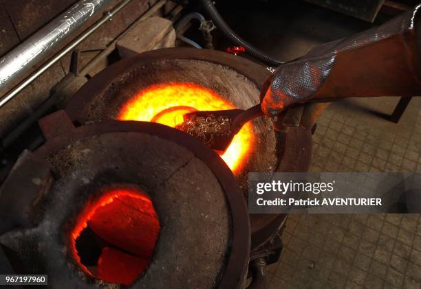 Gold jewelry purchased by the company Gold By Gold are prepared to be melted at 1000 degr?es,and transformed into gold bullion,on June 26, 2012 in...