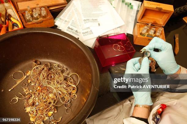 The purity of gold jewelery sent by mail are controlled by the company Gold By Gold,on June 26, 2012 in Paris, France. The price of gold has tripled...