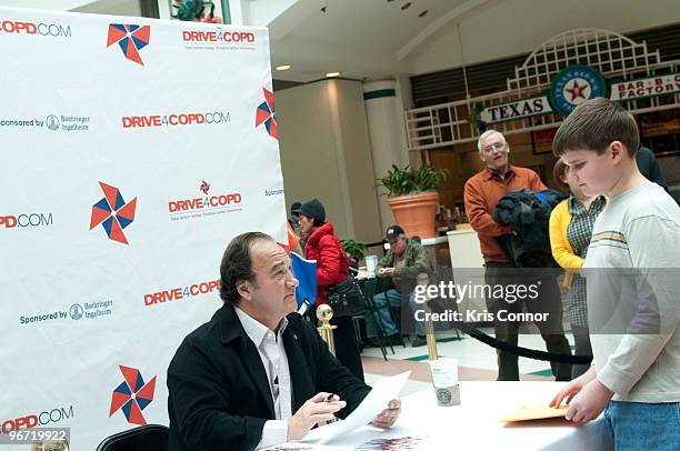 Jim Belushi signs autographs during a Drive4COPD Washington DC Pit Stop at Fashion Centre at Pentagon City on February 15, 2010 in Arlington,...