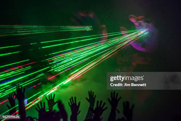 Singer and guitarist Wayne Coyne of The Flaming Lips shoots laser beams from giant hands on stage during Upstream Music Festival at Pioneer Square on...