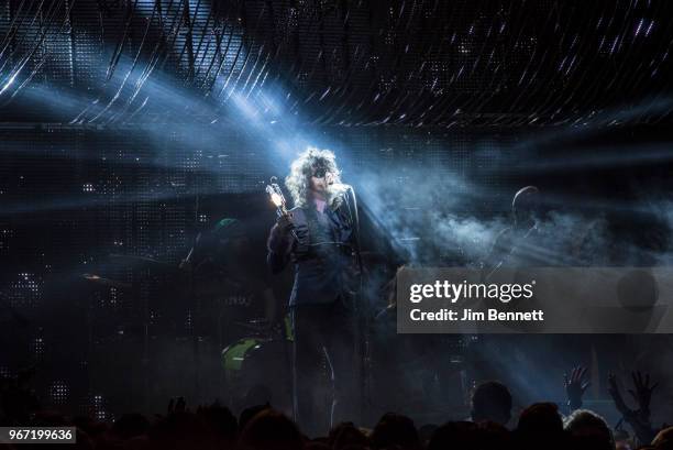 Singer and guitarist Wayne Coyne of The Flaming Lips performs live on stage illuminated by a work lamp during Upstream Music Festival at Pioneer...