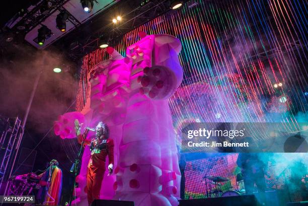Multi-instrumentalist Steven Drozd and singer and guitarist Wayne Coyne of The Flaming Lips perform live on stage in front of a giant pink inflatable...